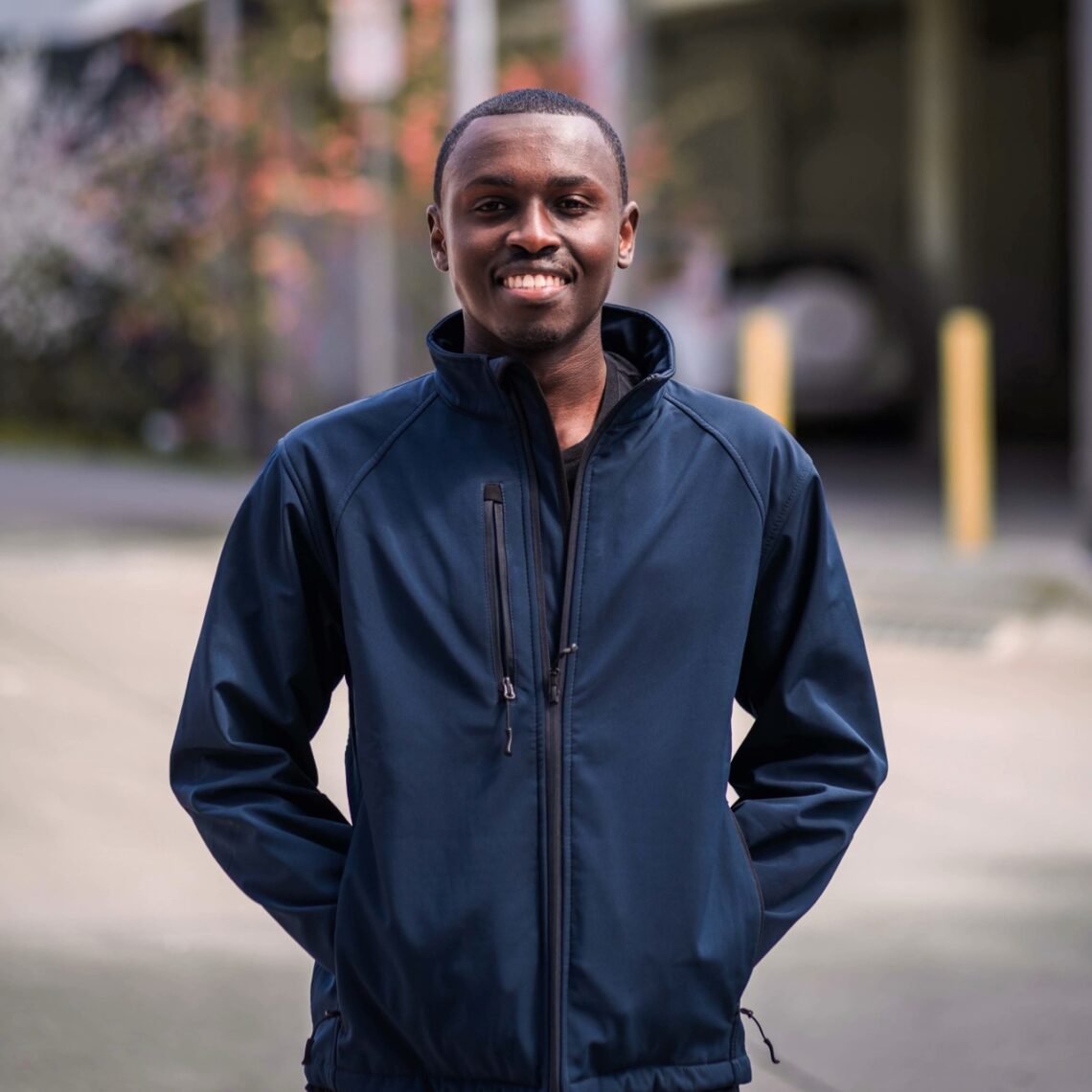 Koome-Portrait-2-square-Orange Large