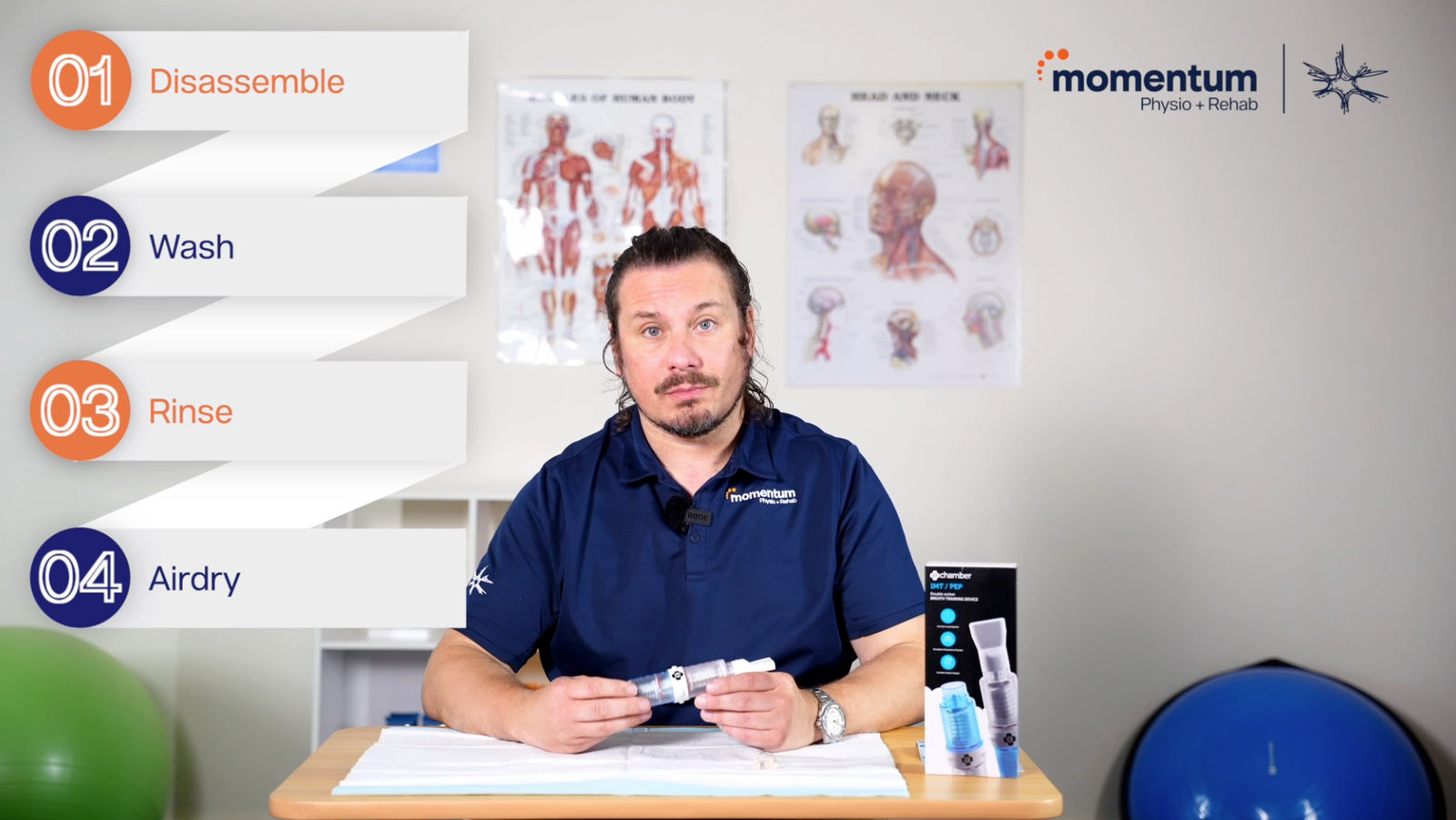 Momentum Long COVID Program - physio instructor at desk with anatomy posters