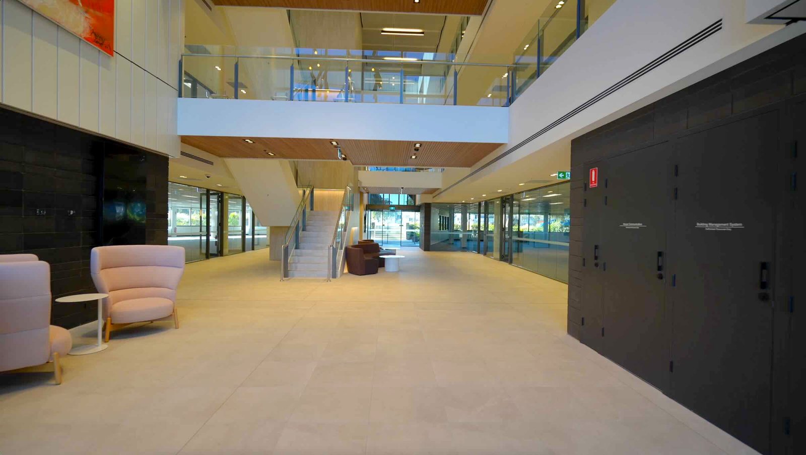 East Edge 2 foyer and ground floor lobby with double-height void and full-height glazing to precinct grounds