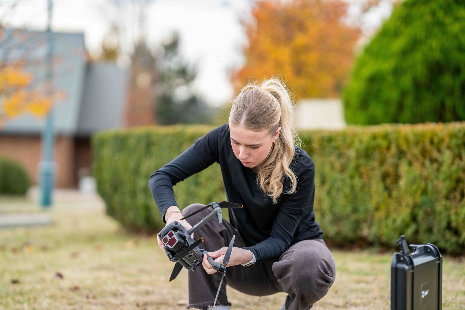Studio Who crew member setting up a drone on location